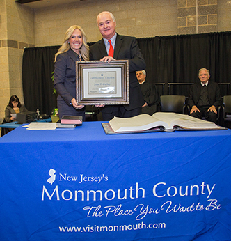 Monmouth County Clerk Christine Giordano Hanlon presents a Certificate of Election to Monmouth County Freeholder John P. Curley at Monmouth County’s 2016 Organization Day on Jan. 6, 2016 at Biotechnology High School in Freehold Township.  Curley received the certificate after being sworn in to his third three-year term in office. 